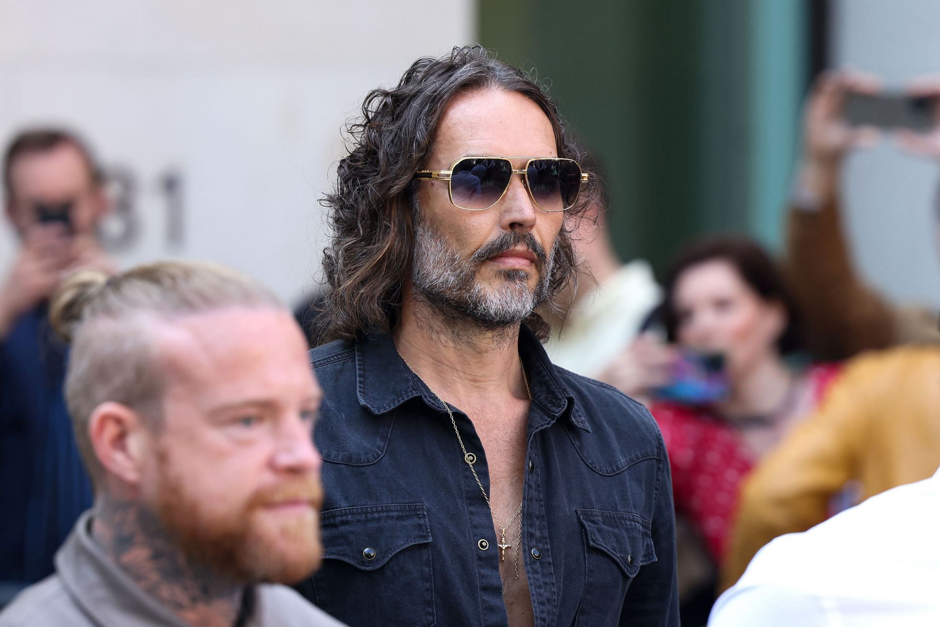 Russell Brand appears in court charged with r*pe and s*xual assault (Image via Getty)